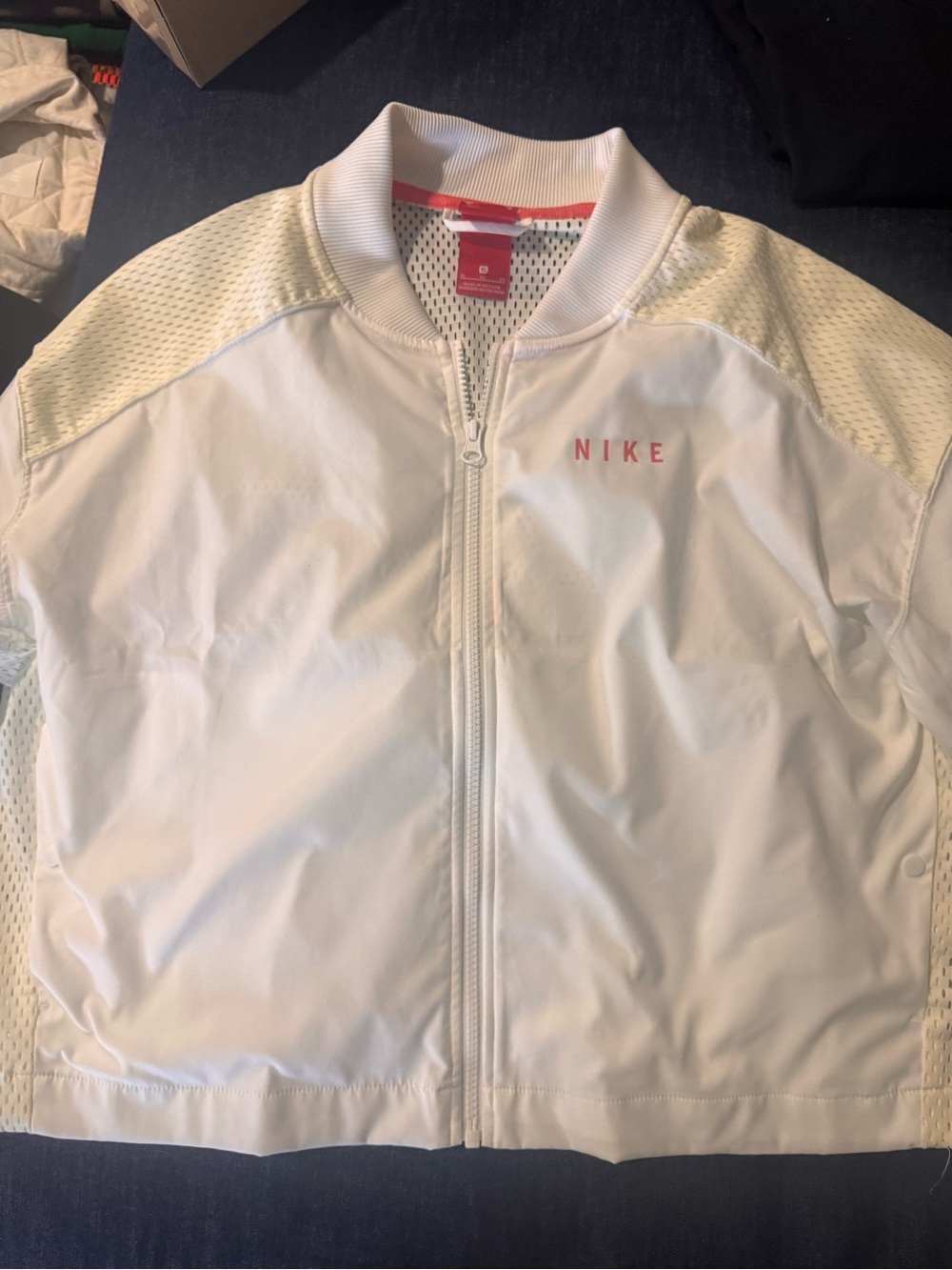 Nike Women’s White Bomber Jacket with Red Tag Accent